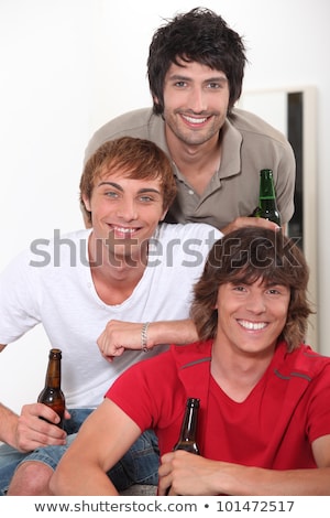 Foto stock: Three Lads With Bottles Of Beer