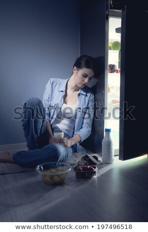 Stock photo: Sleepless Woman Having A Glass Of Milk