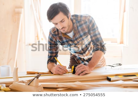 Stock fotó: Precision Throughout Serious Young Male Carpenter Working With