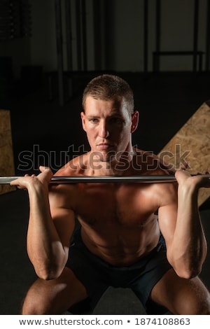 Foto stock: Close Up Portrait Of Man Doing Press Workout At Gym