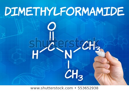 Foto stock: Hand With Pen Drawing The Chemical Formula Of Dimethylformamide