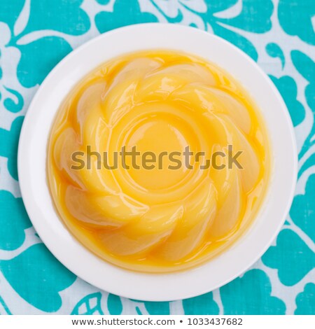 Foto d'archivio: Mango Pudding Jelly On White Plate Top View