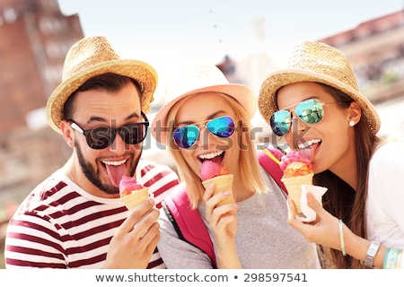 Foto stock: Group Of Smiling Friends With Ice Cream Outdoors