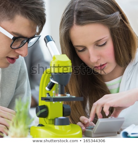 Foto stock: High School Students Girl And Boy Working Together At Biology C