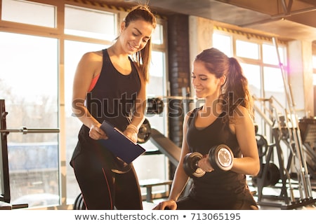 Zdjęcia stock: Fitness Female Instructor Lifting Dumbbells