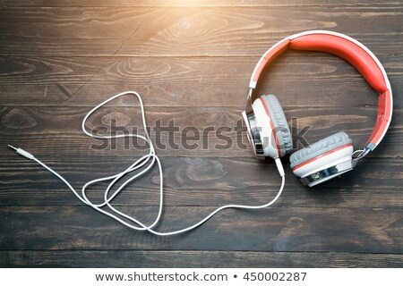 Stock fotó: Man Listening To Mp3 Player On Headphones Relaxing Laying On Rug