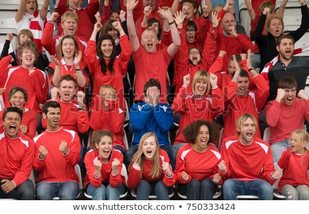 Foto stock: Fan Amongst Rivals At Football Match