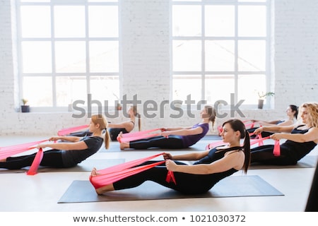 Stock photo: Pilates Yoga Resistance Band Red Rubber Gym Woman