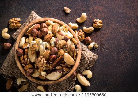 Stockfoto: Walnuts And Pine Nuts On Dark Stone Table