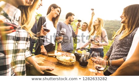 Stock photo: Friends In A Fancy Restaurant Toasting With Italian Red Wine