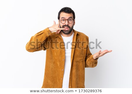 Foto stock: Portrait Of Thinking Handsome Man In Jacket Talking On Cellphone