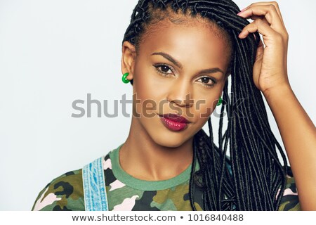 Stockfoto: Woman In A Red Shirt With Hands In Her Black Hair