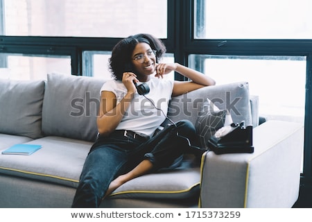 Foto stock: Retro Hipster Girl Talking On Old Fashioned Phone Looking Into P