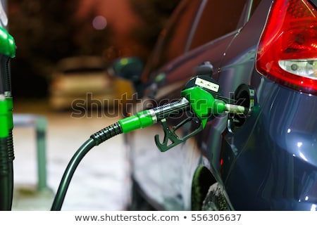 ストックフォト: Car Refueling On A Petrol Station In Winter At Night