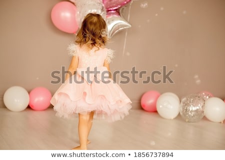 [[stock_photo]]: Smart Woman In A Bright Pink Room