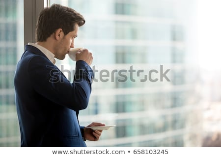 Сток-фото: Thoughtful Man Having A Mug Of Coffee