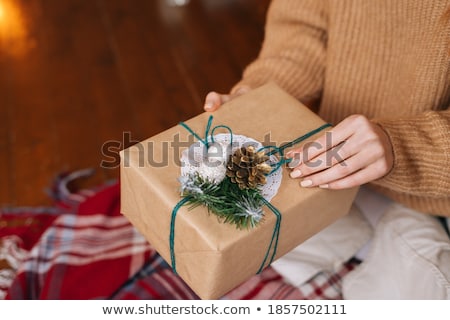 Stock fotó: A Beautiful Woman Opening A Present