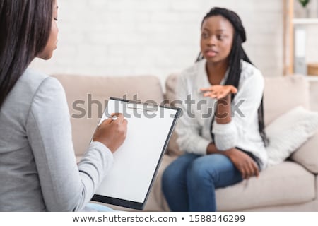 Stock fotó: Psychologist Writing Notes During Counseling Session