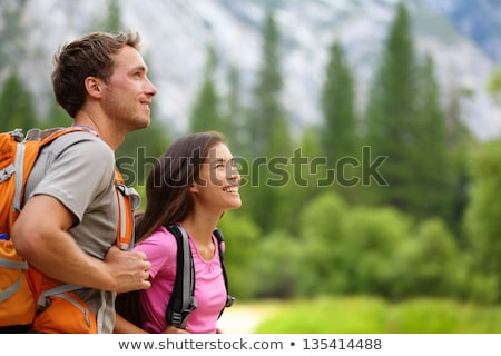 Hiking Couple On Travel Hike Outdoor Trekking - Young Active People Lifestyle Camping With Bags In F Stockfoto © Maridav