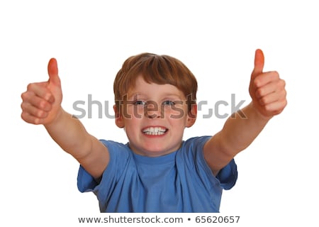 Foto stock: Thumbs Up Shown By A Happy Young Boy