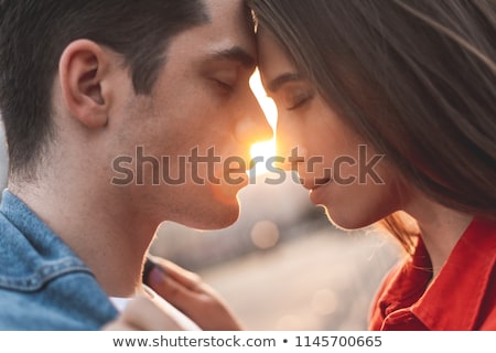 Stockfoto: Passionate Couple Standing Embraced With Eyes Closed