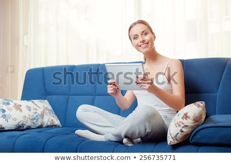 Stock photo: Woman Relaxing On A Sleeper Couch