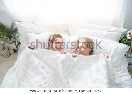 Zdjęcia stock: Attractive Couple In Love Under White Bed Sheets