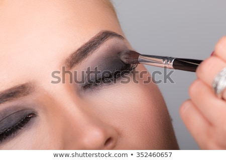 Сток-фото: Woman Getting Make Up Isolated On White