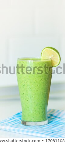 Foto stock: Green Smoothie With Spinach In A Glass On A Wooden Background