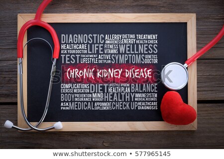 Foto d'archivio: Kidney Disease Medical Concept On Red Background