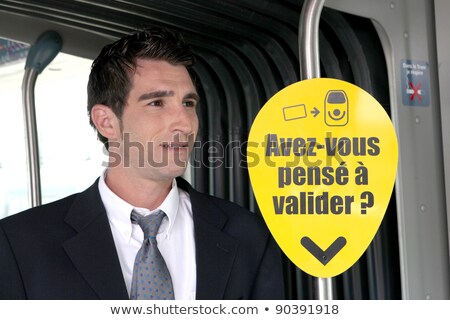 Foto d'archivio: Young Man Looking Over His Shoulder On Tram