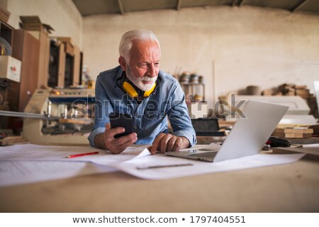 Stock fotó: Architect Looking At His Cellphone