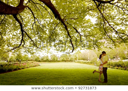 ストックフォト: Loving Asian Couple Under Tree In The Park
