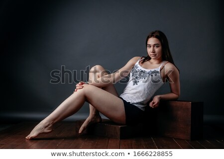 Stok fotoğraf: Portrait Of A Acrobat Pertty Girl Workout On The Floor