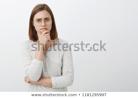 [[stock_photo]]: Woman In Anxious Pose On White Background