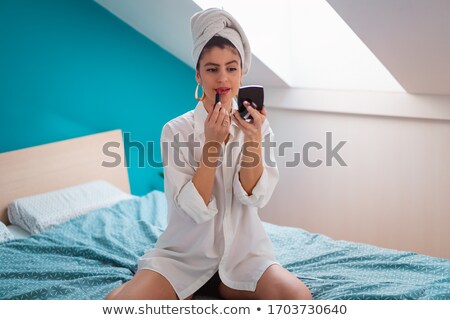 Stock fotó: Woman Getting Ready In The Morning Applying Makeup