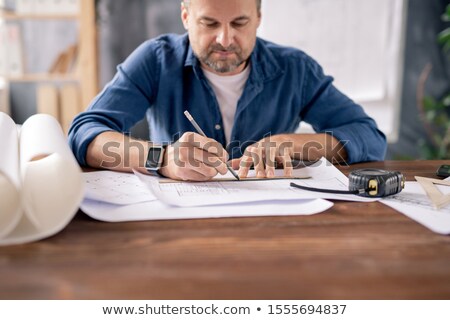 Stock foto: Bearded Mature Engineer Using Pencil And Ruler While Drawing Line On Sketch