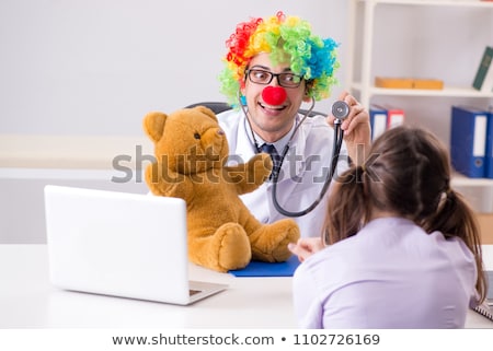 Stok fotoğraf: The Funny Pediatrician With Little Girl At Regular Check Up