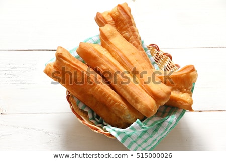 Stock photo: Bread With Butter And Deep Fried Dough Sticks