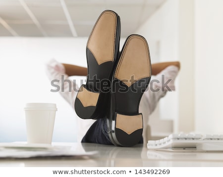 Stok fotoğraf: Business Man With Feet On Desk