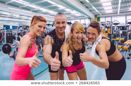 Stock photo: Athletic Man And Woman After Fitness Exercise With Thumbs Up On