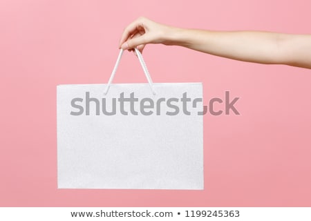 Stock photo: Close Up Of Female Hand Holding Shopping Bags