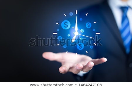 ストックフォト: Time Is Money The Concept Of Time And Money A Man Holding A Lot Of Money And Shows Up On Time