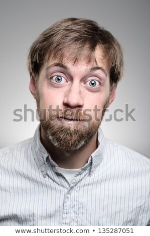 Foto stock: Young Man Blowing Cheeks