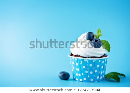 Foto stock: Cupcake With Cream And Blueberry On Pink