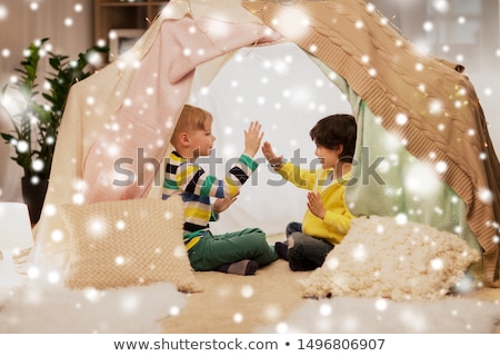 Сток-фото: Boys Playing Clapping Game In Kids Tent At Home