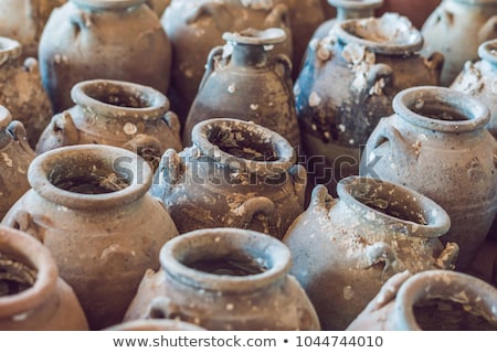 Stock photo: Ancient Vietnamese Traditional Pots Overgrown With Seashells