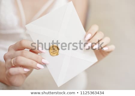 Stockfoto: Close Up Woman With Slim Body Holding In Hands The Invitation Card Blue Pink Color Square Shape Enve