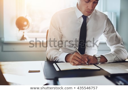 Stockfoto: Young Handsome Lawyer Working In His Office