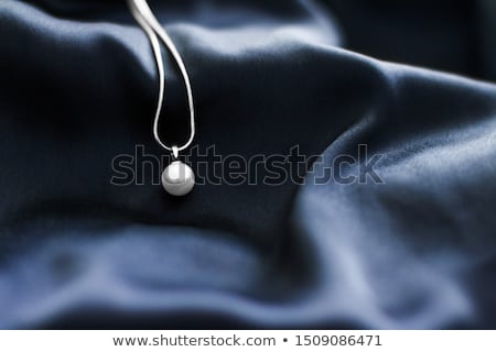 Stockfoto: Luxury White Gold Pearl Necklace On Dark Blue Silk Background H